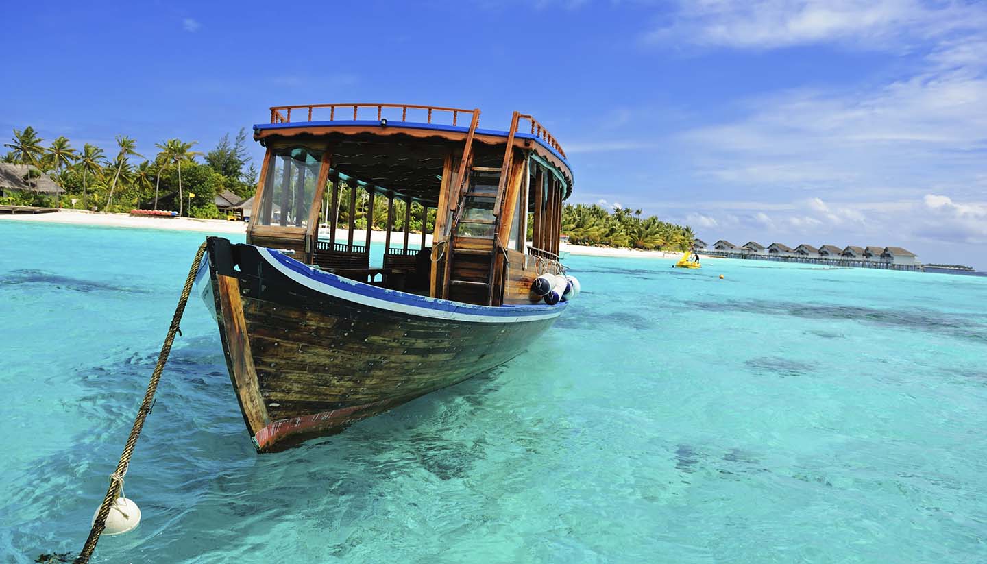 Maldivas - Wooden Dhoni Boat on the shore of the Maldives