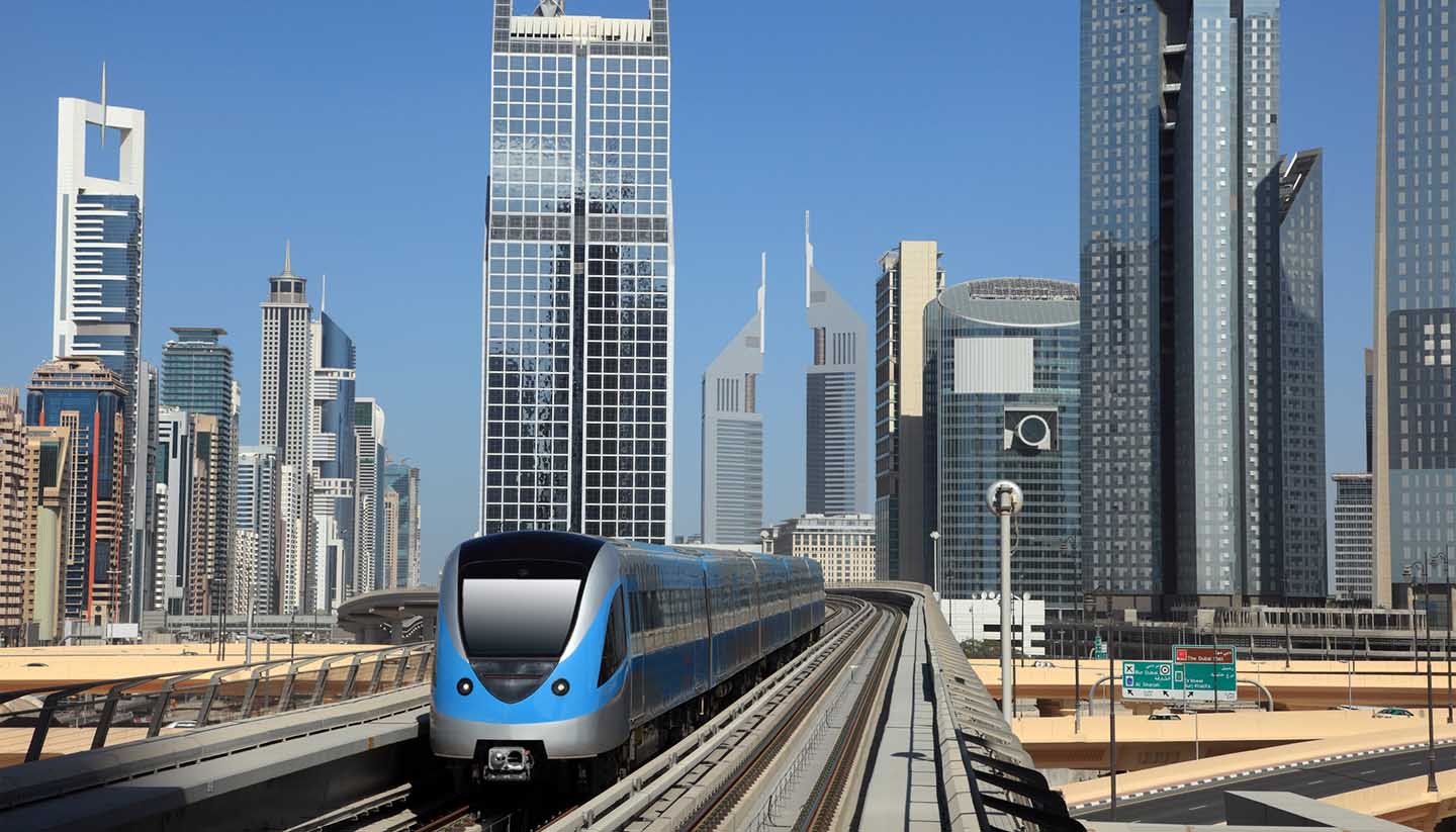 Dubai - Metro train downtown in Dubai, UAE.