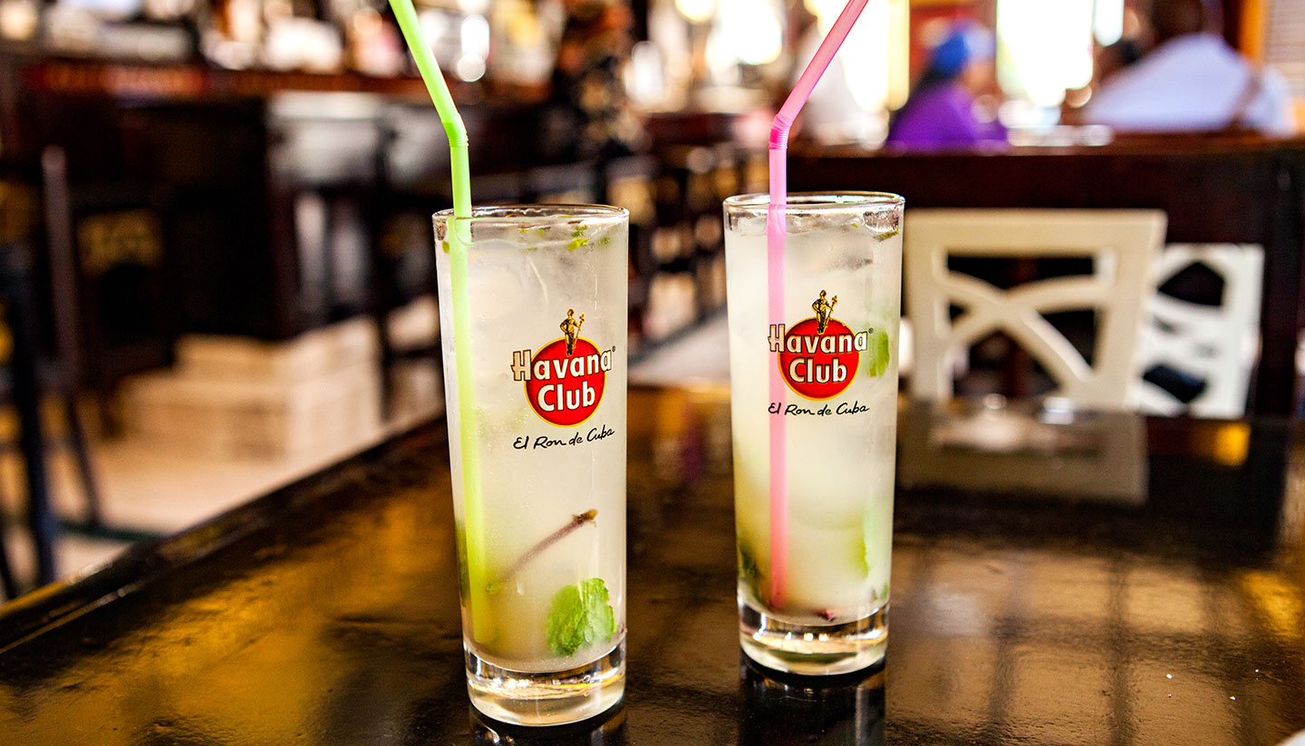 Cuba - Two glasses of Havana Club with mint leaves and a straw each