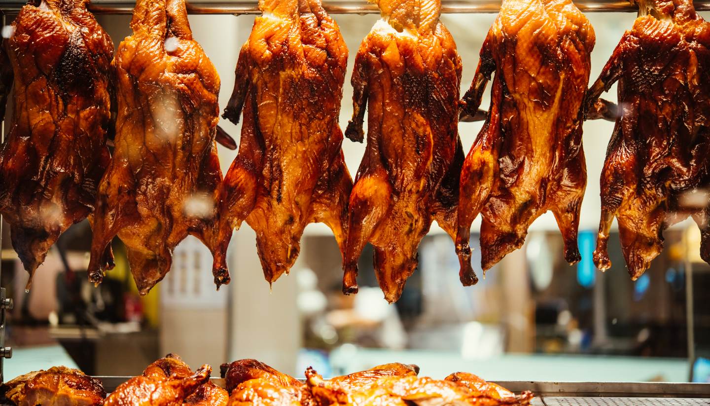 Beijing - Roast duck hanging in shop window